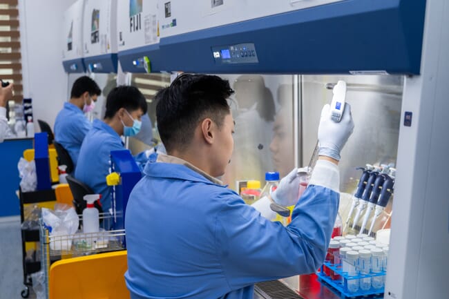 Technitians in a laboratory working on aquaculture-related analysis.